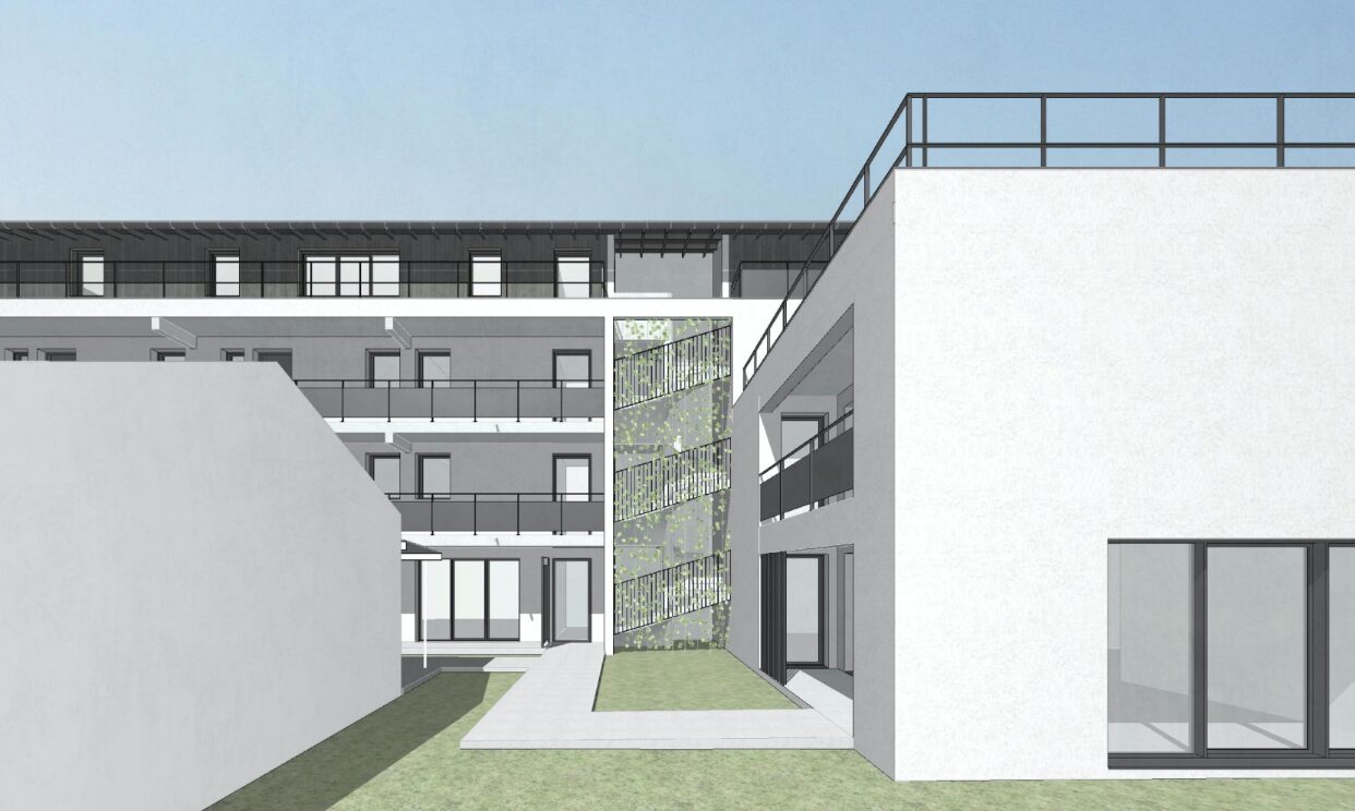 Perspective du programme de logements familiaux autour d’une cour paysagère, en juin 2026